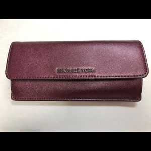 MK metallic gold wallet with gun metal hardware